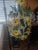 Bring cheerful cottage charm to your space with this whimsical vintage tole chandelier featuring hand-painted black-eyed...