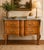 Mid-19th century Louis XVI-style walnut commode featuring intricate parquetry, refined ormolu mounts, and a rich marble...