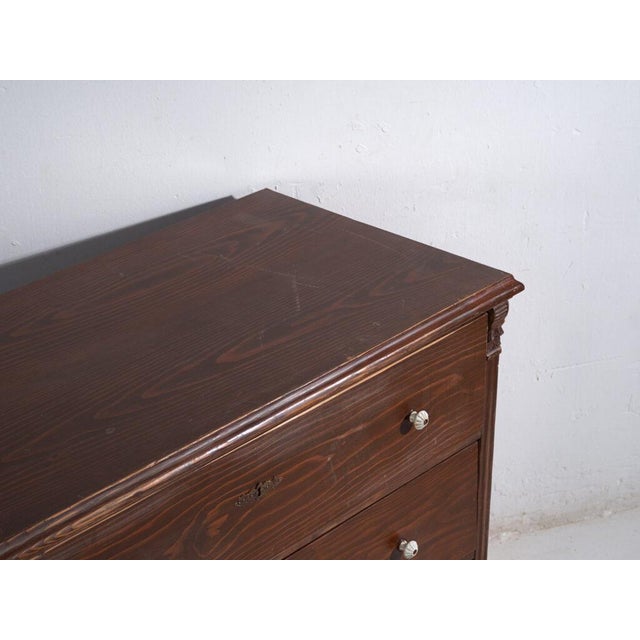 Antique solid pine chest of drawers from Central Europe, dating to around 1900, featuring a rustic countryhouse aesthetic...