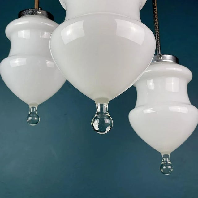 Vintage white murano pendant lamp made in Italy in the 1960s. The rare Murano lamp with an unusual shape. An example of...