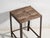 This antique industrial stool in pine wood and iron is an industrial seat with a tubular iron frame and a pine slatted...