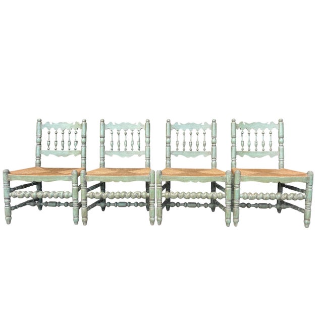 Set of four Charles Pollock for William Switzer English spindle back dining chairs featuring hand-finished frames with...