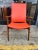 Mid century modern lounge chair. This piece features a walnut frame with orange vinyl upholstery. Great for any living or...
