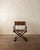 A vintage italian modern folding director’s chair in dark stained wood and warm brown leather, produced in italy during...