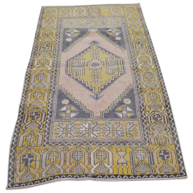 Hand-knotted with care using traditional rug-making techniques, this wool rug blends timeless craftsmanship with a modern...