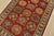 A tribal Caucasian Kazak rug hand-knotted with fine wool on a cotton foundation. This rug features geometric motifs set...