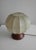 Beautiful mid-century table lamp designed by Achille Castiglioni, made in Italy in the 1960s. It has a round oak base and...