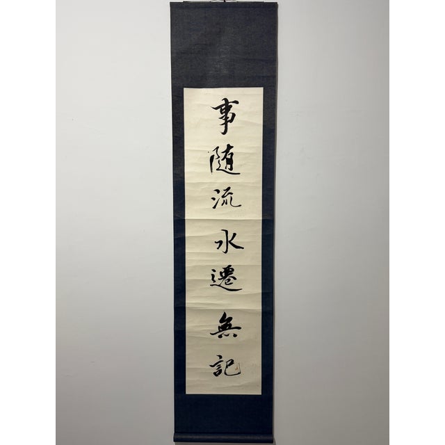 This vintage pair of Chinese handwritten calligraphy hanging scrolls is elegant oriental wall decor. Each scroll measures...