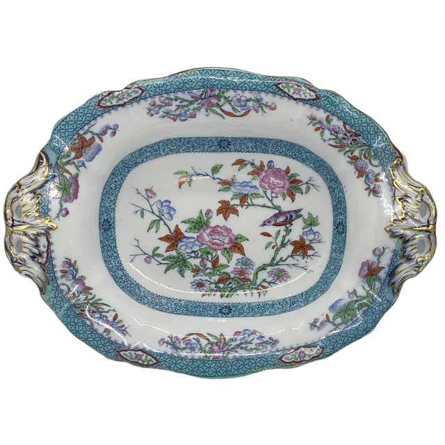 Mid 19th Century Minton Porcelain Oval Raised Footed Serving Centerpiece Bowl. This stunning bowl has two handles and is...