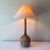 Vintage tafellamp style raw mango wood tall teardrop table lamp with vintage coolie lampshade.