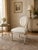 This elegant mid-20th century dining chair, crafted in the French Louis XVI style, features exquisite hand-carved...