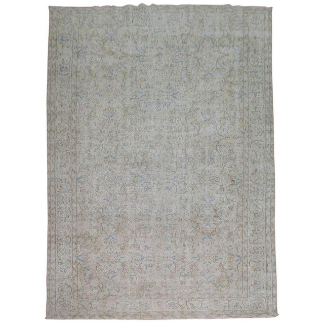 Distressed Small room size one of a kind room Turkish rug with pops of light blue. Measures: 6'7'' x 10'.