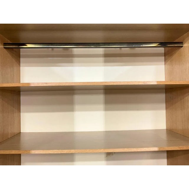 For sale is a beautiful, two-door vintage wardrobe from the 1960s. It impresses with its simple design and elegant ash...