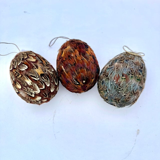 Set of three handcrafted feather ornaments. These are rustic, while providing a true natural element to the atmosphere....