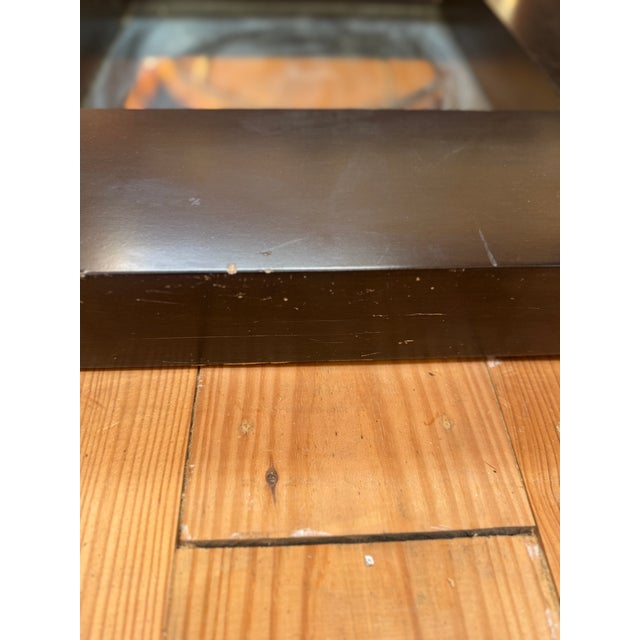 Ebonized square mirror with gilt carved barbola swags. Frame is a dark stained espresso, presents black from a distance.