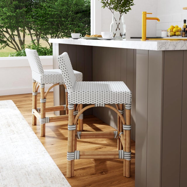 Combining clean lines with tropical materials, this Butler Specialty Company stylish low back counter stool infuses modern...