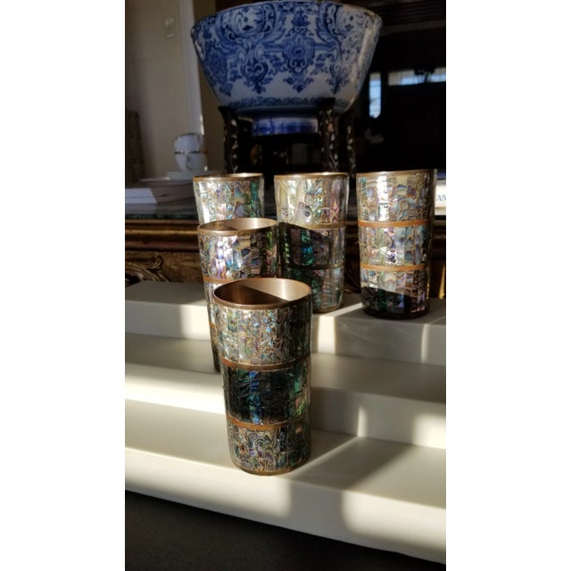 Beautiful vintage brass goblets clad in abalone shell... These make beautiful pen or brush holders. Great for bar displays...