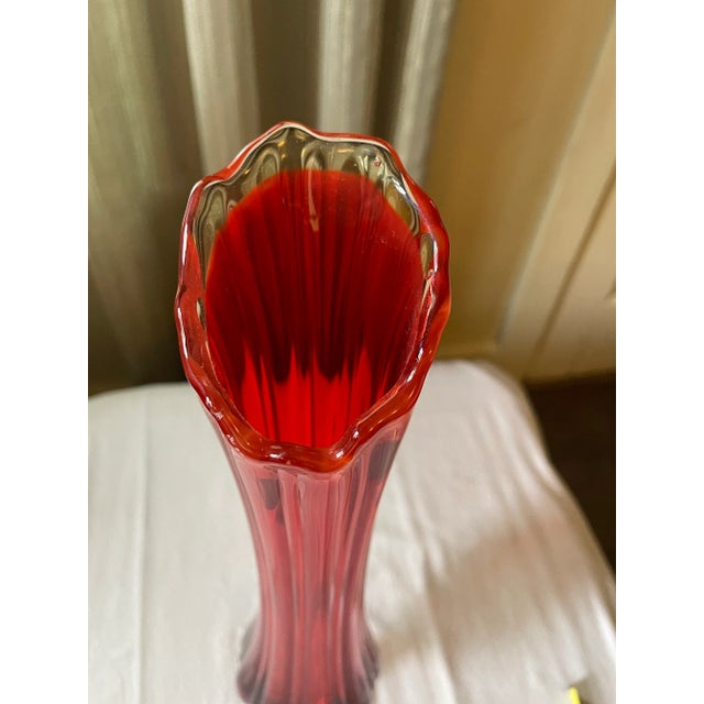 Beautiful Amberina Swung glass. Glows beautifully under light.