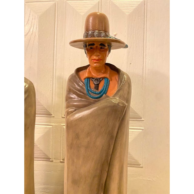 Unique hand painted vintage ceramic statues of a man and woman. Artist Paige Typher signed the bottom. Cool and unique...