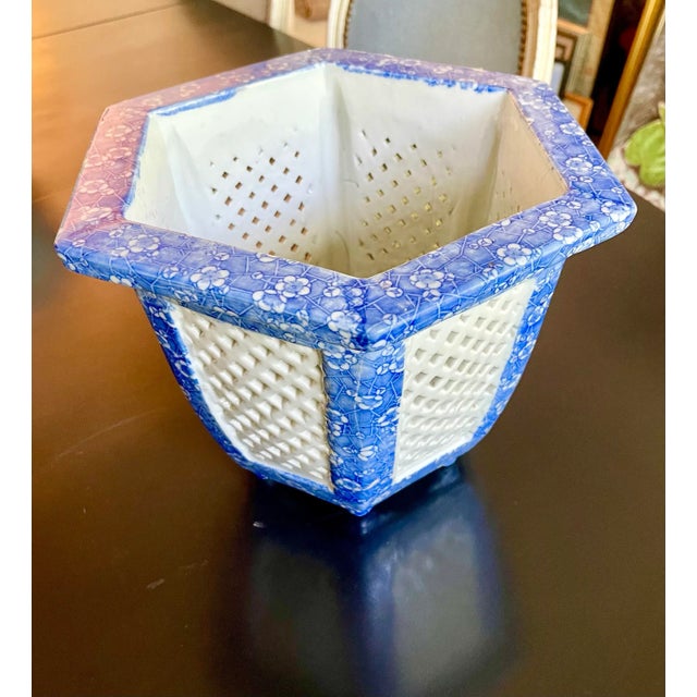 English blue calico and white pierced planter. Mounted on feet. Unsigned. Early 20th century.