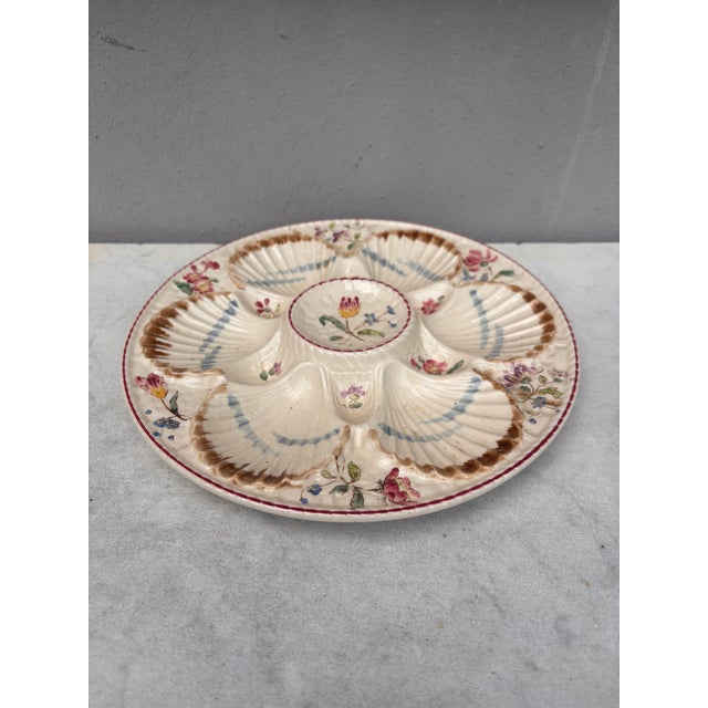 French Majolica oyster plate with flowers circa 1890 signed Longchamp.