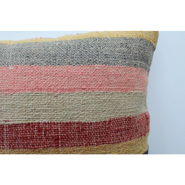 This Turkish pillow cover is made from the highest quality vintage Kilim in 100% wool on the front. The back is covered in...