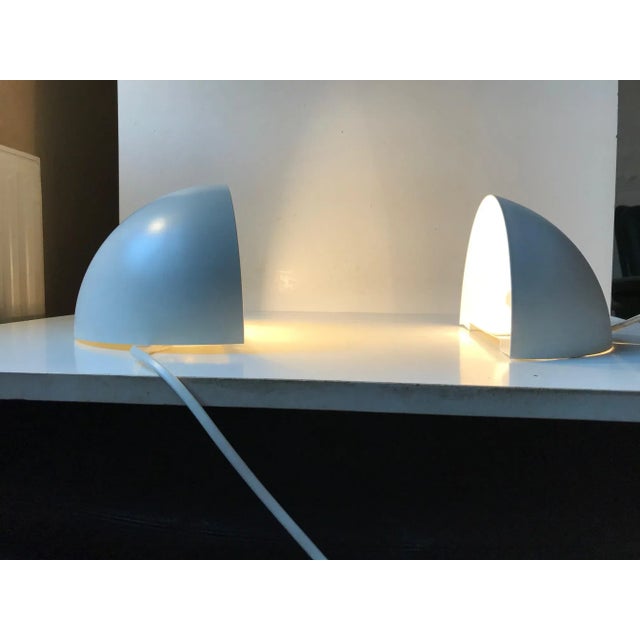 A pair of up- or downlight sconces in white powder coated steel. Designed and manufactured by Lyfa in Denmark during the...