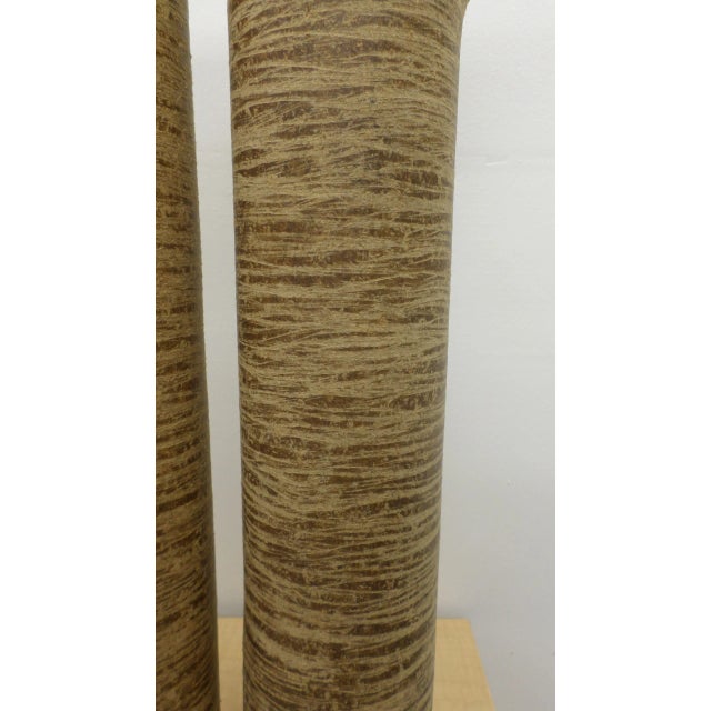 These sculptural bud vases are made of recycled craft paper by Brazilian artist Domingos Tortora. The vases are drilled...