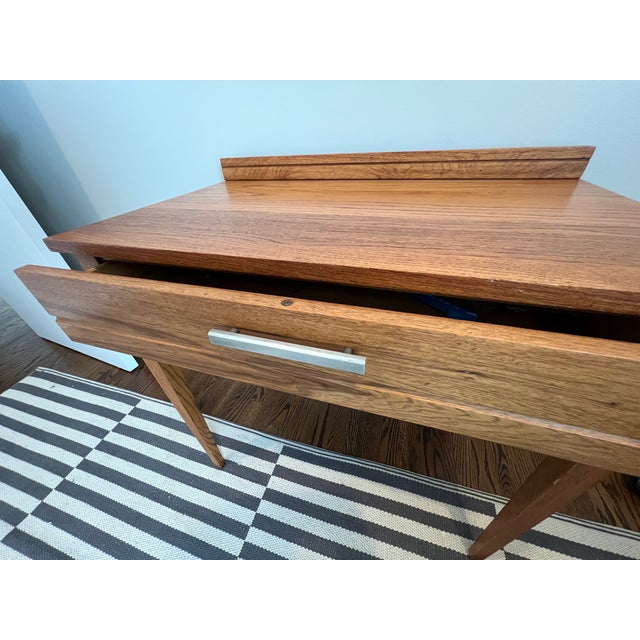 Gorgeous solid oak Mengel permanized writing desk with original aluminum hardware. In perfect condition.