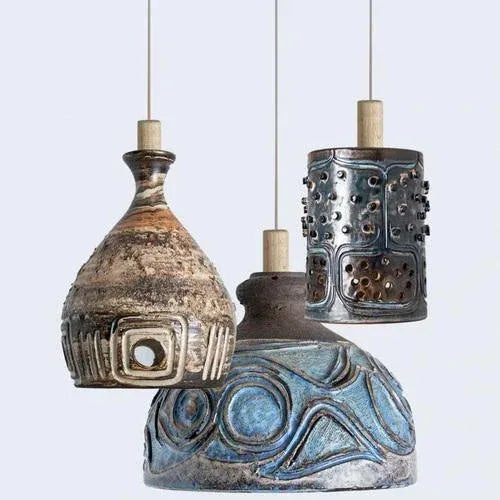Playful arrangement of stunning round hanging lamps with an unusual shape, made with rich colored brown ceramics,...