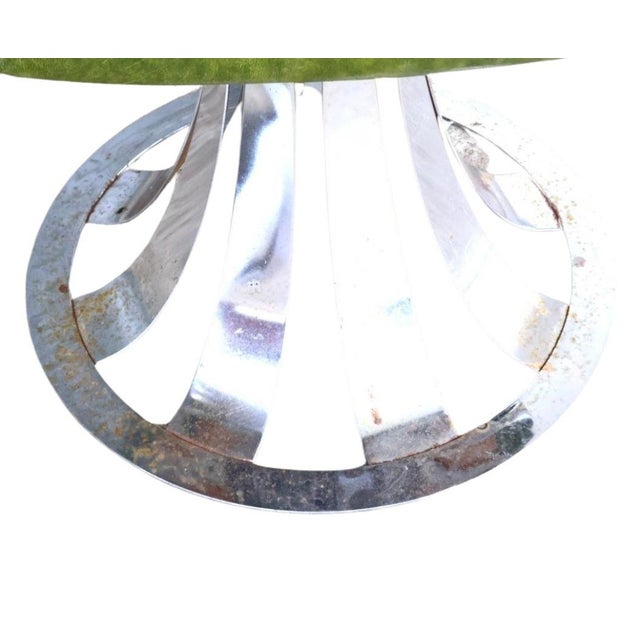 A stunning Mid-Century Modern dining set in the style of Russell Woodard, featuring a sculptural chrome base glass-top...