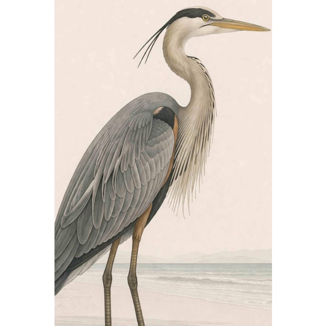 Refined coastal artwork featuring a great blue heron standing in shallow water, rendered with delicate feather detail and...