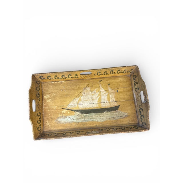 Antique, handmade and hand-painted wooden tray table with painting of a sailboat in center. Coffee table height and tray...