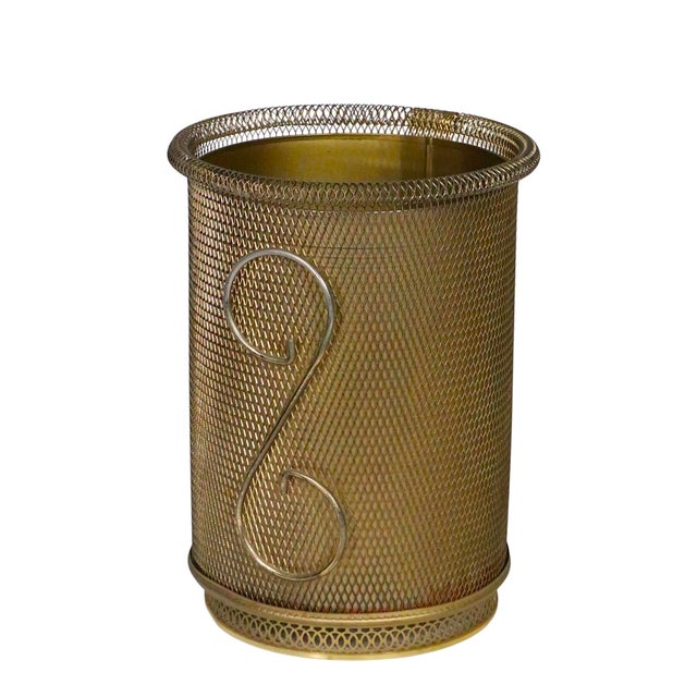 Chic Mid Century, Hollywood Regency waste can, having gold tone metal mesh exterior with large S shaped decorative...