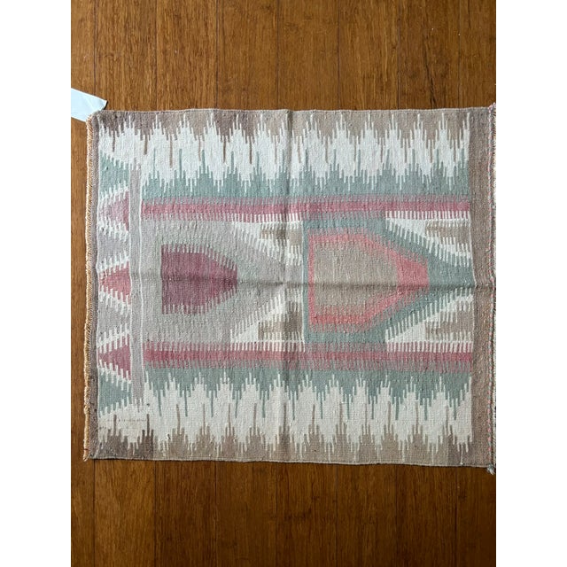 Bring charm, character, and artisan heritage to your home with this small vintage Anatolian kilim rug, handwoven...