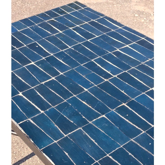 Stylish accent table featuring a rectangular petrol blue mosaic tile top with a durable black metal frame. The tiled...