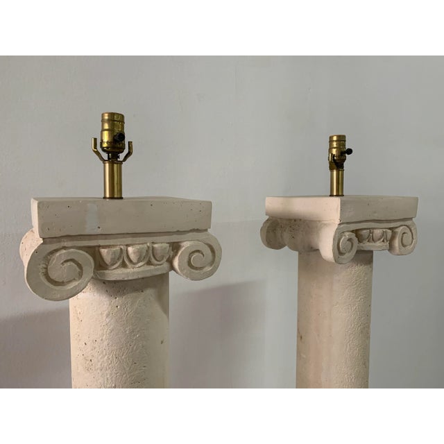 Beautiful vintage floor lamps in plaster, designed as Ionic columns. Original wiring is in working condition.