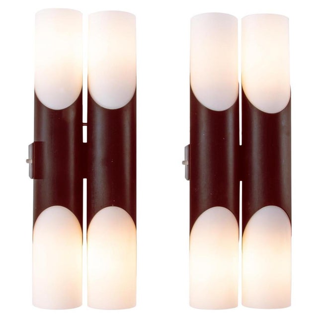 Elegant pair of modernist double wall sconces with white opal glass diffusers on a tubular coffee brown brass frame....