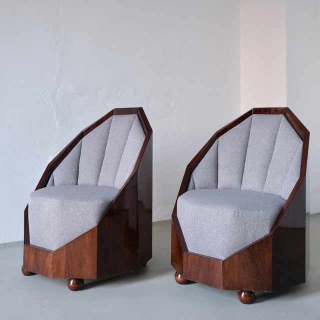 Art deco lounge set attributed to french designer léon bouchet, composed of two club chairs and a matching octagonal...