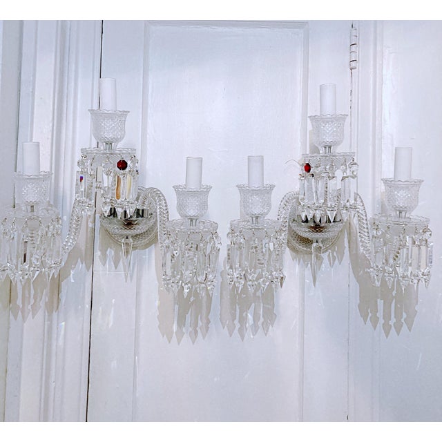 These are a pair crystal wall sconces with handblown crystal arms, hand cut body parts and hand cut spear shaped crystal...