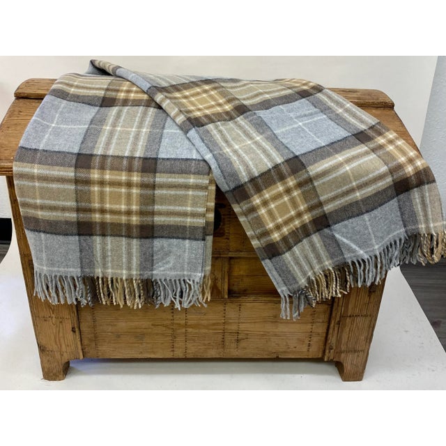 Super Soft Merino Wool Throw In A Classic Tan And Gray Plaid Pattern. Made in England A versatile throw in a classic tan &...