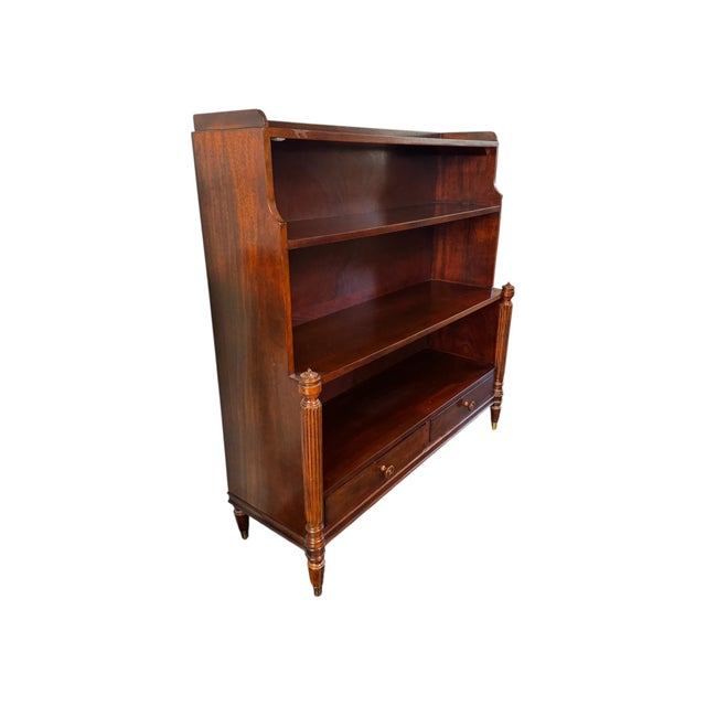 Elevate your space with this timeless Ralph Lauren open bookcase, crafted in a rich mahogany finish with classic...