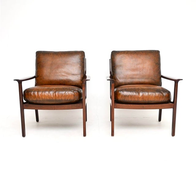 A beautifully designed pair of vintage Scandinavian armchairs by Frederik Kayser. They were made in Norway by Vatne...
