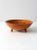 This is a vintage hand-painted wood bowl. The footed wooden bowl features a pinecone and branch painted interior design.