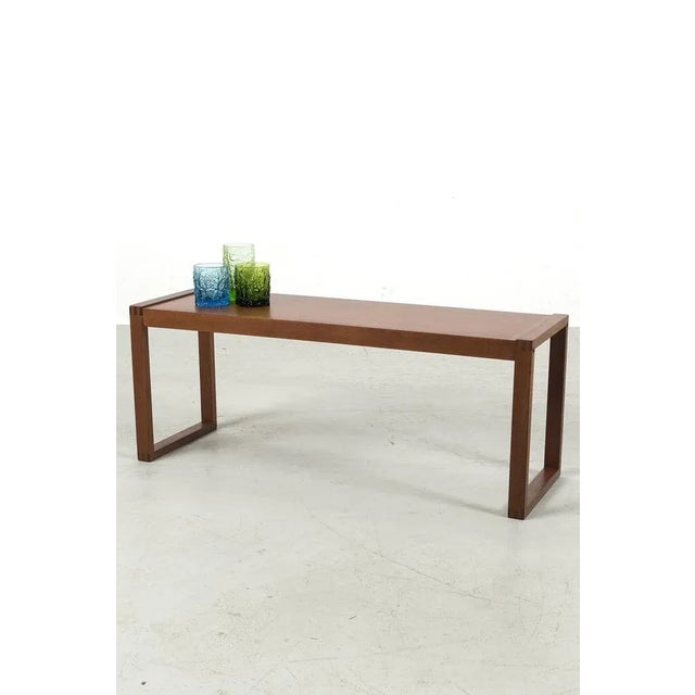 Modernistic Danish teak coffee or side table with beautiful exposed wood joins. In good vintage condition. Measurements H....