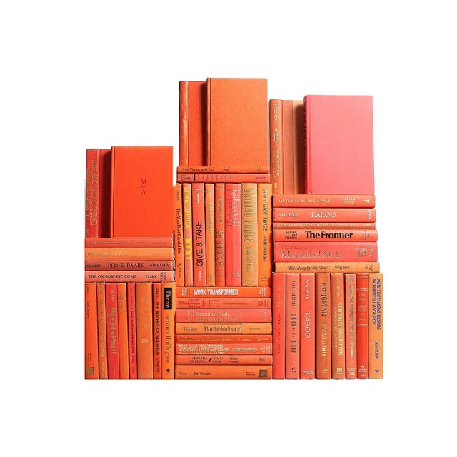 The Modern Grove Book Wall features fifty contemporary books in warm and vibrant shades of orange to create a beautifully...