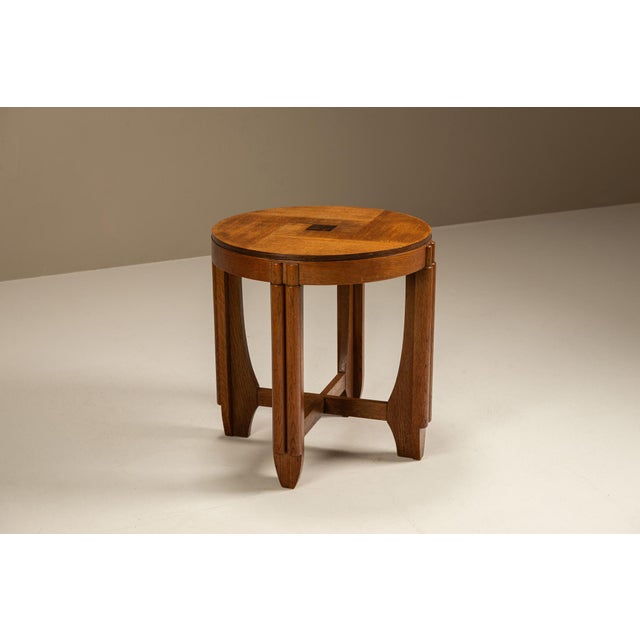 A fine example of Amsterdam School furniture design, this compact oak side table embodies the decorative yet structured...