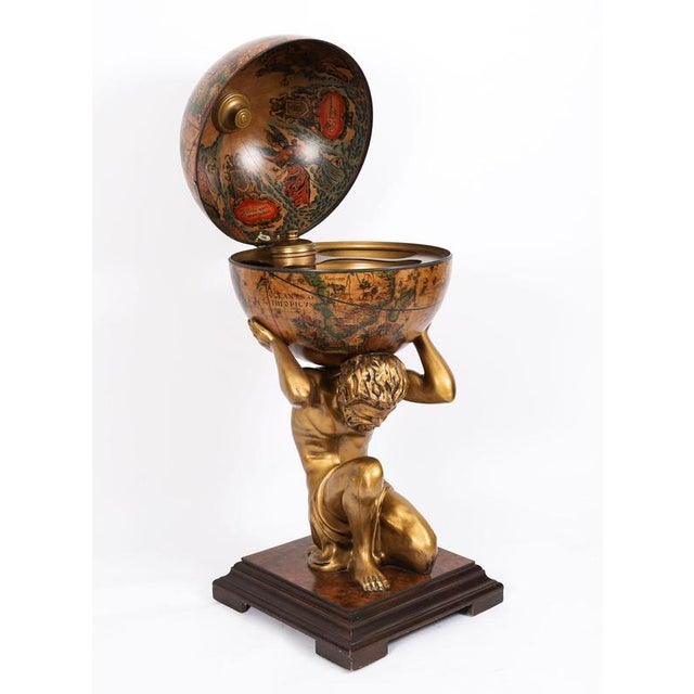 This is a spectacular Italian Mid Century Modernist Globe Cocktail drinks cabinet in the form of Atlas holding the globe...