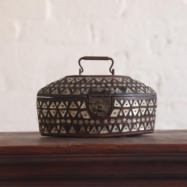 This 19th Century Belgian painted pine box showcases charming folk-art character through its intricate inlaid detailing...