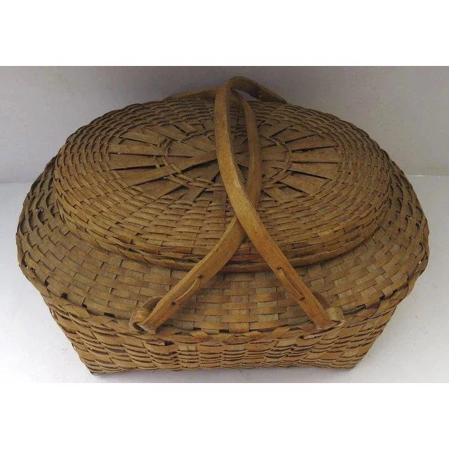 Early to Mid 1900s, large vintage ash splint picnic market basket with lid and swing bentwood handles. Sturdy. Shows some...